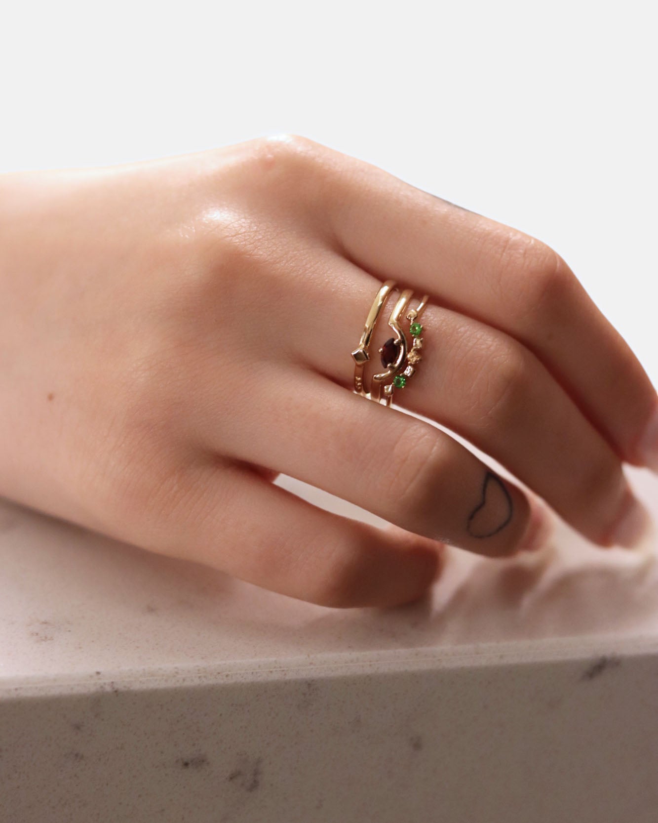 Daring Triad Ring Garnet Gold
