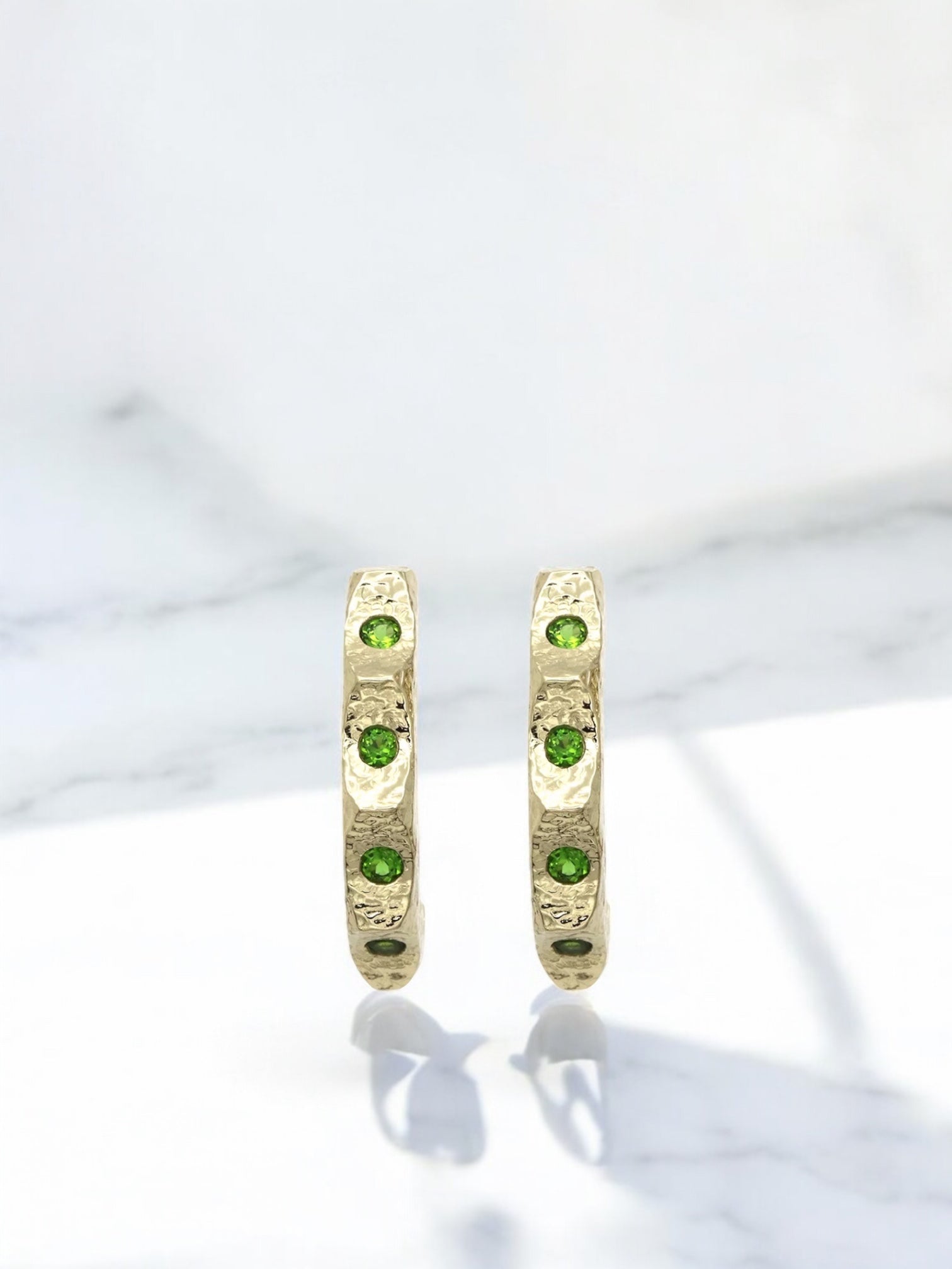 Carolin_Stone_Jewellery_HIS_earrings_Gold_Chromediopside_Earrings_marble_banner-Photoroom-2.jpg